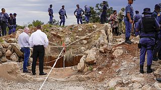 What to know about a standoff between police and illegal miners at a South Africa mine