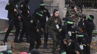 Hamas frees eight more hostages, Israel delays prisoner release 